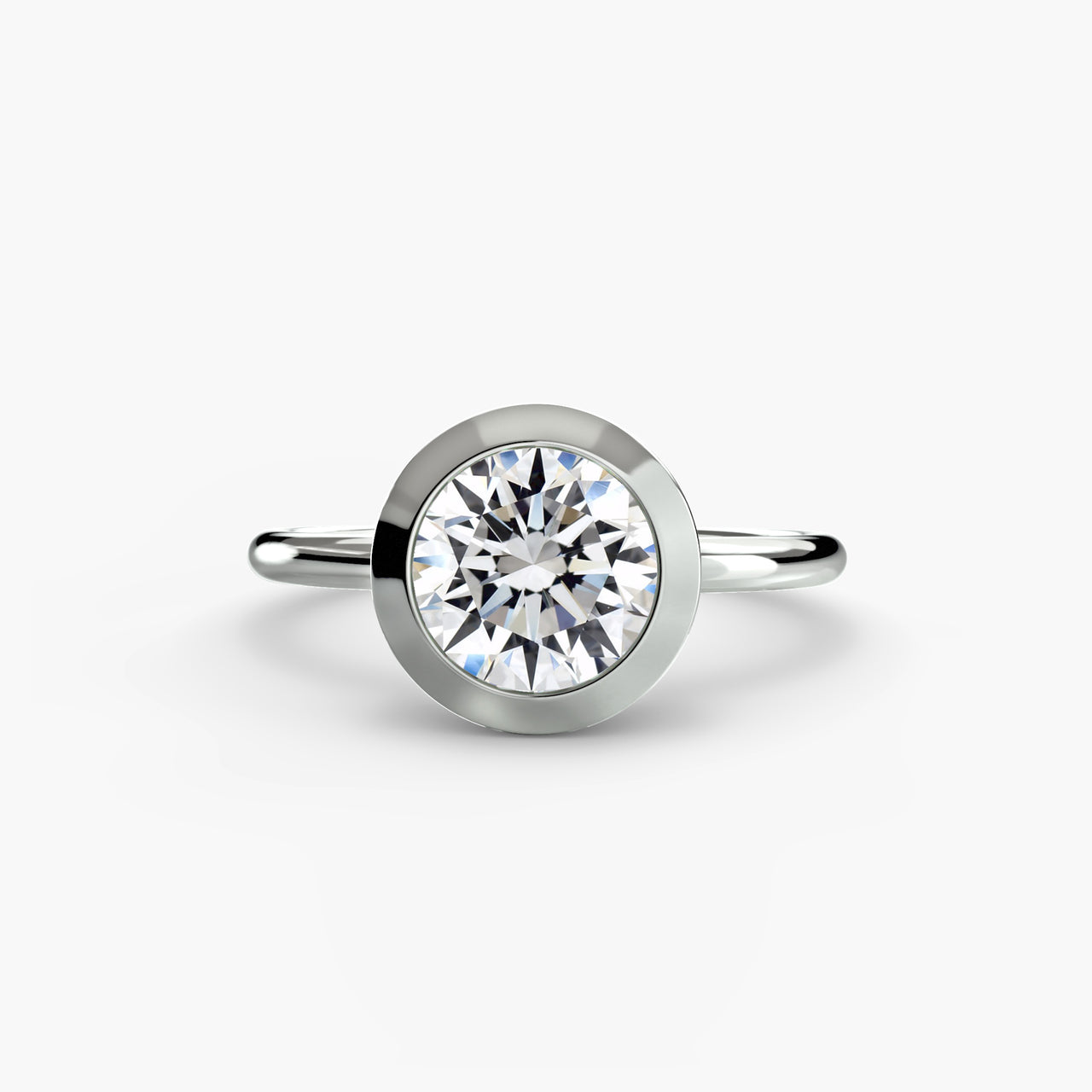 14K White Gold / Round The Bezel Set Solitaire
