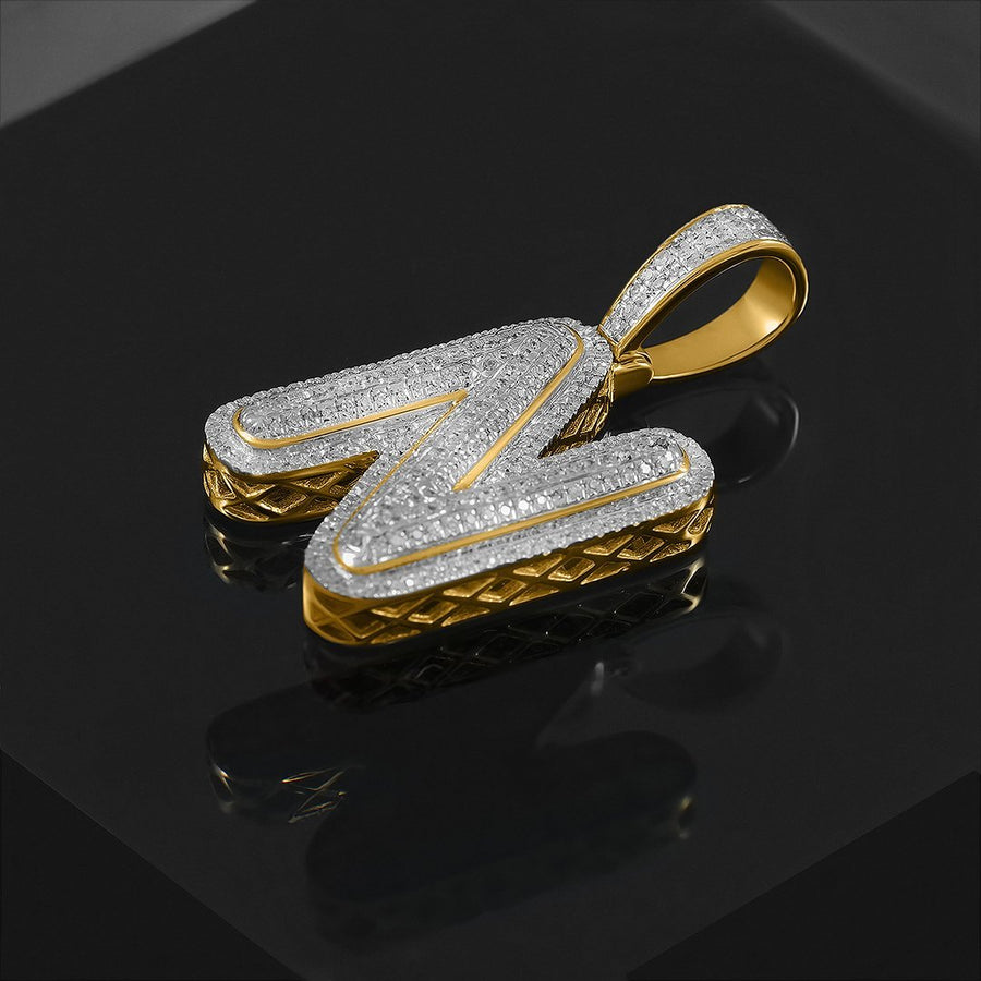 Colgante de oro amarillo de 10 k con diamantes N de 0,41 quilates 
